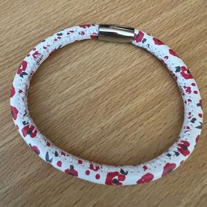 Brighton poppy charm bracelet with magnetic closure. Charms slide on.